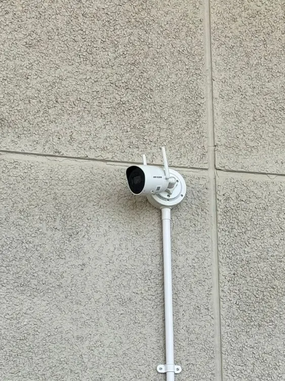 Wireless Hikvision camera mounted on the wall of a residential terrace